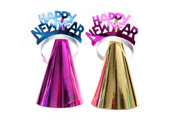 colorful shiny new years hats and tiara crowns isolated on white