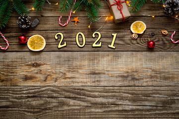 Fototapeta na wymiar New Year background 2021. Christmas composition on a wooden background.
