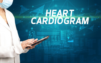 Fototapeta na wymiar doctor writes notes on the clipboard with HEART CARDIOGRAM inscription, medical diagnosis concept
