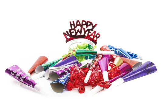colorful new years noise maker horns and whistles isolated on white