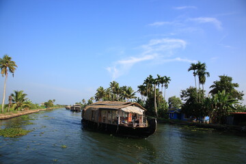 Scenic view of Houseboat sailing on Kerala backwaters in Alleppey, Kerala, India