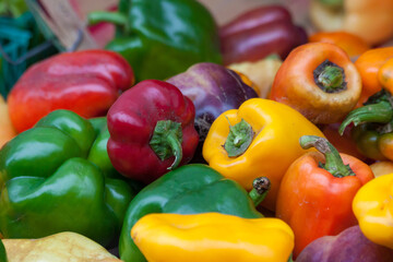 Red, Green and yellow peppers at a farmer's market