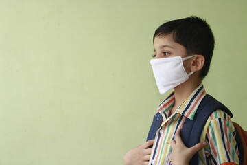 Kid getting ready for school after lock down. Kid eager to go to school after lock down. Indian Kid with mask and preparing for school 