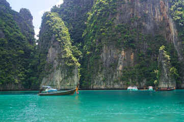 Stunning tropical rocks with palm trees in the Bay on Phi Phi island in Thailand. Landscape