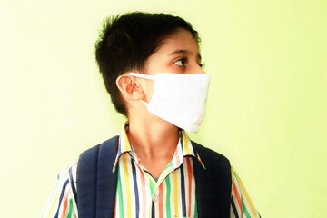 Kid getting ready for school after lock down. Kid eager to go to school after lock down. Indian Kid with mask and preparing for school 