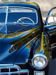 Retro car show. Black classic retro car. Vintage car fragment.
Black GAZ 12 ZIM at the at the retro...