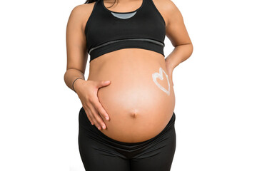 Pregnant woman with a drawn heart on belly.
