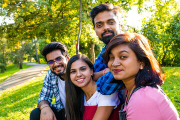 Young colleagues discussing ideas outdoors social distance