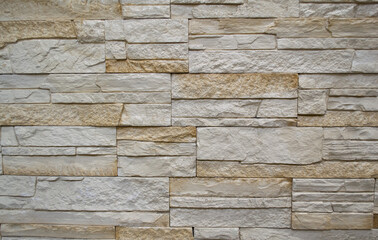 Wall finishing tiles in the form of white and beige stone