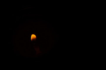 a candle lit in the dark