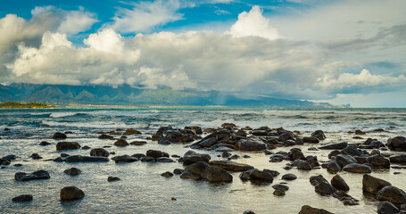 Marvelous shore. Large boulder among the waves in the sea. Hawaii