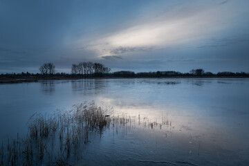 Beautiful evening view with a frozen lake