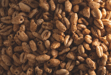 Macro close up of inflated wheat cereal, selective focus