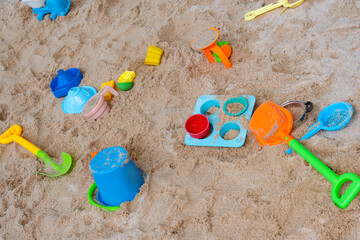 Fototapeta na wymiar Colorful sand toy on the sand beach