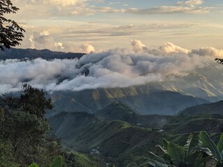 beautiful sunset in the mountains with clouds