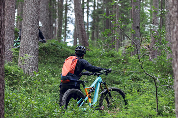 Fototapeta premium Cycling outdoor adventure in alpine forest at the lago di braies, Dolomites, Italy