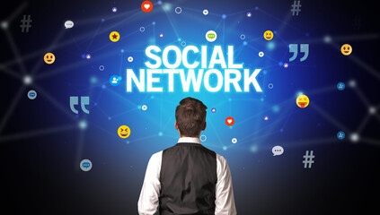 Rear view of a businessman with SOCIAL NETWORK inscription, social networking concept