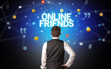 Rear view of a businessman with ONLINE FRIENDS inscription, social networking concept