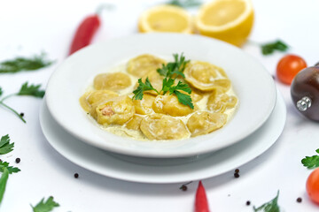 Italian ravioli pasta with meat or fish on white background