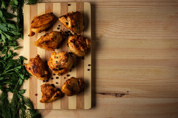 grilled chicken fillet seasoned with pepper and herbs cutting Board