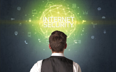 Rear view of a businessman with INTERNET SECURITY inscription, online security concept