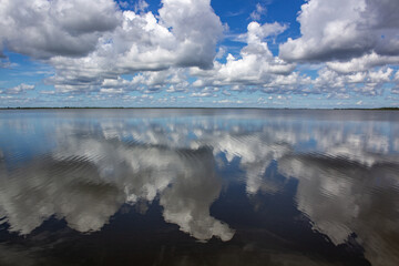 Reflections of clouds on blue lake Ibera, Corrientes, ARgentina