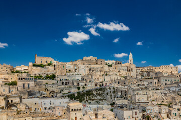 Fototapeta na wymiar Matera, Basilicata, Italy - Panoramic view from the top of the Sassi of Matera, Barisano and Caveoso. The ancient houses of stone and brick, carved into the rock.