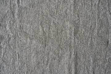 Natural linen texture background. Crumpled fabric of gray color, rough texture, copy space