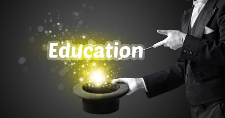 Magician is showing magic trick with Education inscription, educational concept