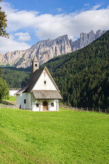 Fototapeta na wymiar saint sebastian church and latemar mountain, nova levante (Welschnofen) Alps, Dolomites, italy 