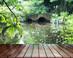 wood top table on pond nature park