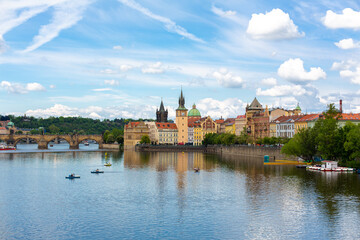 Fototapeta premium The landscape of the city of Prague view from the Vltava river on the ancient architecture of the city