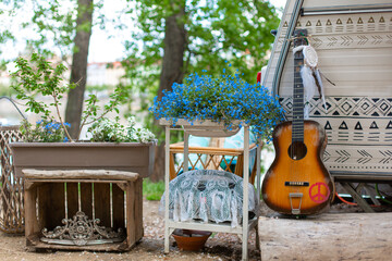 Summer cafe in a green park. Themed hipster cafe in the city park. Decor items