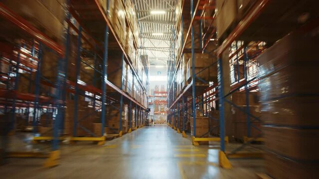 Time-Lapse of Camera Moving Through Big Retail Warehouse full of Shelves with Goods in Cardboard Boxes and Packages. Logistics, Sorting and Distribution Facility for further Product Delivery