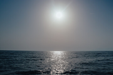 Fototapeta na wymiar Deep bue simple sea horizon with clean sky seascape view in horizontal