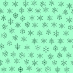 Christmas seamless pattern of snowflakes on green background. Flakes pattern made of different elements isolatedon green. Winter new year backgrond fortextile, fabric, wrapping. Vector illustration