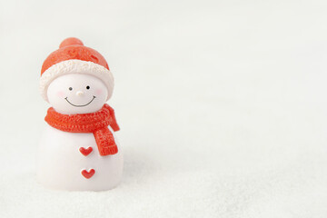 Merry Christmas and happy new year concept. Cute snowman figure on snow with copy space