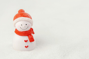 Merry Christmas and happy new year concept. Cute snowman figure on snow with copy space