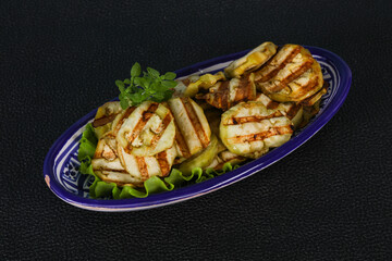 Grilled eggplant slices served basil