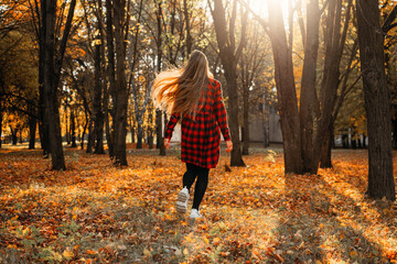 Fall its coming, Hello autumn. Beautiful blond girl on autumn background. Stylish young lady in park. Beautiful blond girl outdoors © irissca