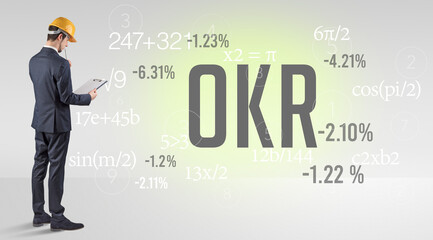 Technology Engineer in hard hat with OKR abbreviation