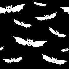 Naklejka premium Halloween seamless black and white pattern with white bats. Bat silhouette icon on black background for wrapping paper, postcards, home textile, costumes. Vector illustration. Greeting card concept