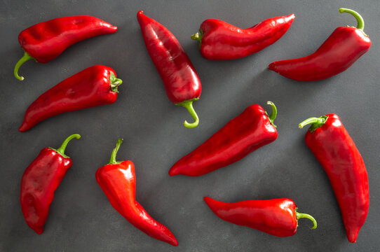 Fresh ripe red capia pepper, hot chili pepper on grey rustic table, turkish vegetable spice concept