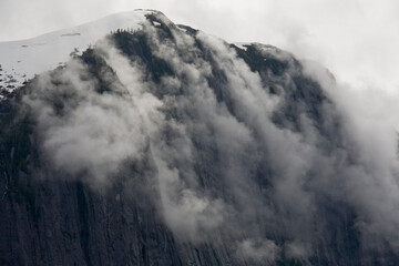 Fog Rolls over Cliff, Misty Fjords National Monument,  Alaska