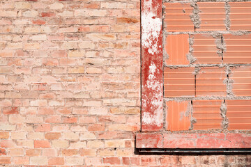 View of old building, bricked up window