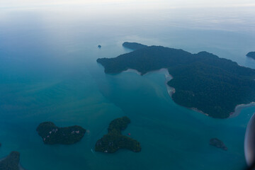 Small tropical islands aerial view from airplane.