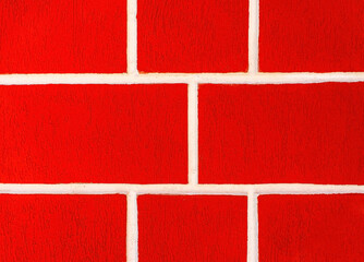 Fototapeta premium Bright red background with white seams. Wall surface. Building block wall. Copy space