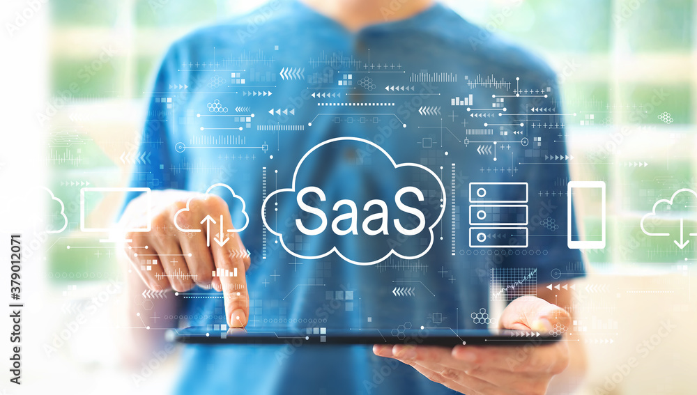 Poster saas - software as a service concept with young man using a tablet computer