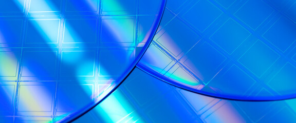 Macro of blue silicon wafer with microchips. Banner format.