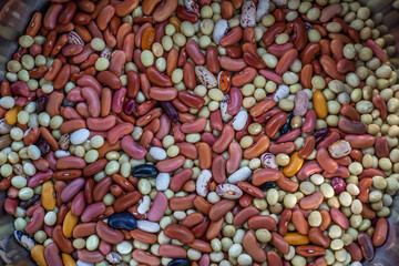 Healthy food background. Colored raw beans on top.